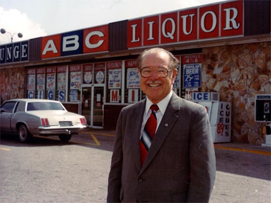 Mr. Holloway standing in front of ABC Liquor store
